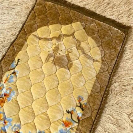 A premium prayer mat with a thick, quilted design for comfort and a non-slip base