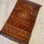 A premium prayer mat with a thick, quilted design for comfort and a non-slip base