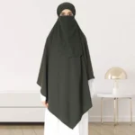 A woman wearing a long, single layer khimar that drapes over the head, and shoulders, falling to about waist length.