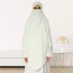 A woman wearing a long, single layer khimar that drapes over the head, and shoulders, falling to about waist length.