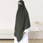 A woman wearing a long, single layer khimar that drapes over the head, and shoulders, falling to about waist length.