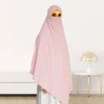 A woman wearing a long, single layer khimar that drapes over the head, and shoulders, falling to about waist length.