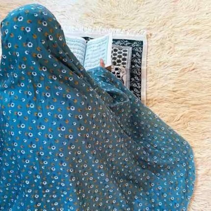 A woman using a lightweight, without sleeves namaz chadar design during Salah.