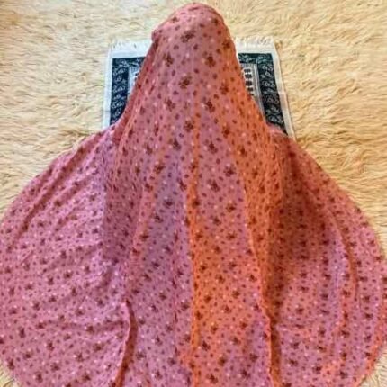 A woman using a lightweight, without sleeves namaz chadar design during Salah.