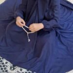 a Kid wearing plain namaz chadar with sleeves for offering prayers