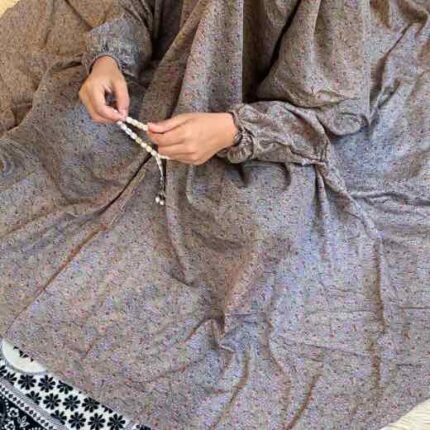 a Kid wearing namaz chadar with sleeves for offering prayers