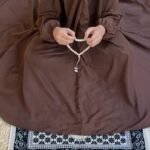 a Kid wearing plain namaz chadar with sleeves for offering prayers