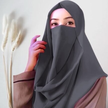 A woman wearing a Misri hijab draped over the head and shoulders with attached Niqab. By Clothifydotpk