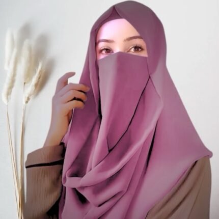 A woman wearing a Misri hijab draped over the head and shoulders with attached Niqab. By Clothifydotpk