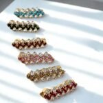 Close-up photo of a brooches with rhinestones.