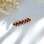 Close-up photo of a brooch with rhinestones.