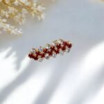 Close-up photo of a brooch with rhinestones.