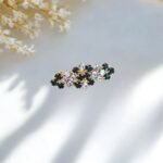 Close-up photo of a brooch with rhinestones.