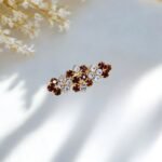 Close-up photo of a brooch with rhinestones.