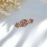 Close-up photo of a brooch with rhinestones.