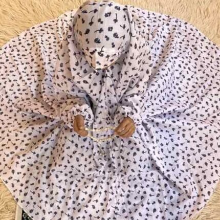 A young girl wearing kids namaz chadar with sleeves, offering salah from Clothifydotpk