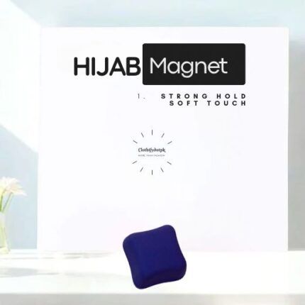A pair of small, matte hijab magnets for securing a scarf.