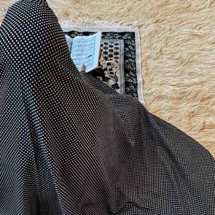 A woman's namaz chadar without sleeves.