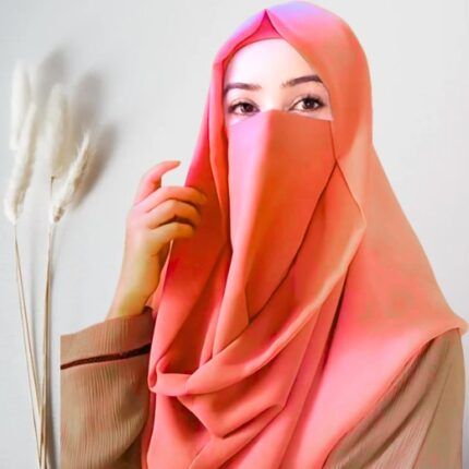 A woman wearing a Misri hijab draped over the head and shoulders with attached Niqab