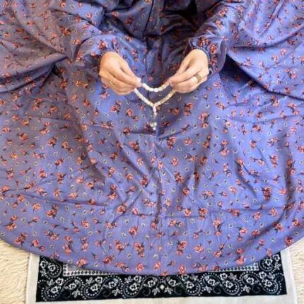 A woman using a breathable soft swiss lawn Namaz Chadar, performing salah By Clothifydotpk