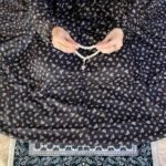 A woman wearing a printed full-length namaz chadar with pocket, showcasing its loose, flowy fit and long sleeves for complete coverage during Namaz. Clothifydotpk