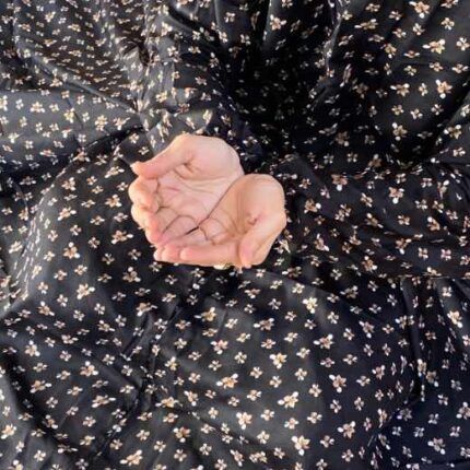 A woman wearing a printed full-length namaz chadar with pocket, showcasing its loose, flowy fit and long sleeves for complete coverage during Namaz. Clothifydotpk