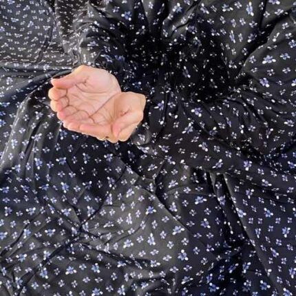 A woman wearing a printed full-length namaz chadar with pocket, showcasing its loose, flowy fit and long sleeves for complete coverage during Namaz. Clothifydotpk