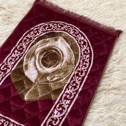A premium prayer mat with a thick, quilted design for comfort and a non-slip base