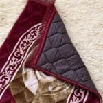 A premium prayer mat with a thick, quilted design for comfort and a non-slip base