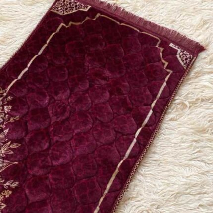 A premium prayer mat with a thick, quilted design for comfort and a non-slip base