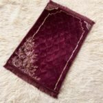 A premium prayer mat with a thick, quilted design for comfort and a non-slip base