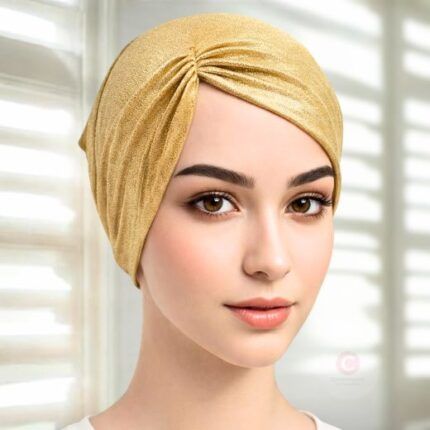 A woman wearing gold side parting Shimmer Hijab Cap By Clothifydotpk