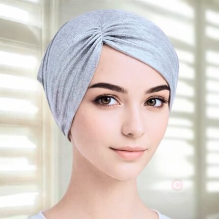 A woman wearing silver side parting Shimmer Hijab Cap By Clothifydotpk