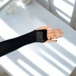 Stretchy, netted fabric arm sleeves.