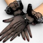 A pair of fancy, imported net gloves featuring a detailed mesh pattern.