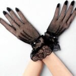 A pair of fancy, imported net gloves featuring a detailed mesh pattern.