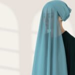 A woman wearing a ready-to-wear instant chiffon hijab, featuring a soft, flowy drape and pre-stitched design for easy wear with inner under cap. By Clothifydotpk