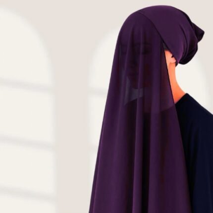 A woman wearing a violet color ready-to-wear instant chiffon hijab, featuring a soft, flowy drape and pre-stitched design for easy wear with inner under cap. By Clothifydotpk