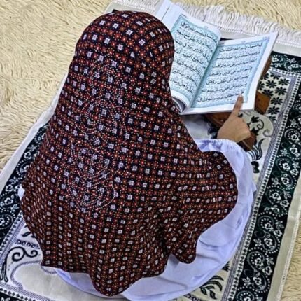 Close-up of a soft, lightweight Fancy Makhna hijab designed for kids namaz with floral print and delicate stone embellishments,featuring secure coverage.