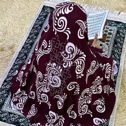 Close-up of a soft, lightweight Fancy Makhna hijab designed for kids namaz with floral print and delicate stone embellishments,featuring secure coverage.