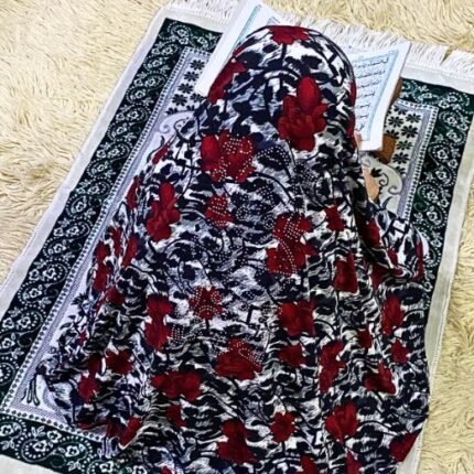 Close-up of a soft, lightweight Fancy Makhna hijab designed for kids namaz with floral print and delicate stone embellishments,featuring secure coverage.
