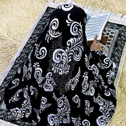 Close-up of a soft, lightweight Fancy Makhna hijab designed for kids namaz with floral print and delicate stone embellishments,featuring secure coverage.