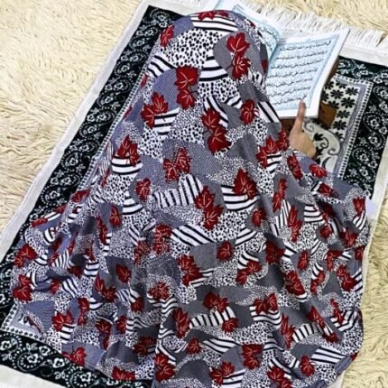 Close-up of a soft, lightweight Fancy Makhna hijab designed for kids namaz with floral print and delicate stone embellishments,featuring secure coverage.