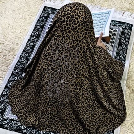 Close-up of a soft, lightweight Fancy Makhna hijab designed for kids namaz with floral print and delicate stone embellishments,featuring secure coverage.