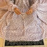 A woman using a breathable soft swiss lawn Namaz Chadar with Sleeves, performing salah By Clothifydotpk