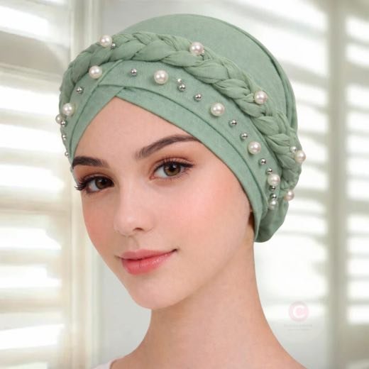 Pearl Turban Hijab Cap012 - 61 A woman wearing a fancy pearl turban hijab cap with delicate pearls, visible under a sheer or light hijab.