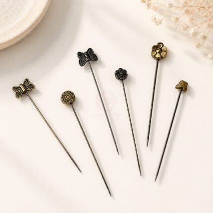 A close-up of a Fancy Metal Hijab Pin. Clothifydotpk