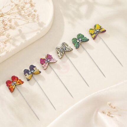 A close-up of a lunafly brooch pin. Clothifydotpk