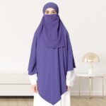 A woman wearing a long, single layer khimar that drapes over the head, and shoulders, falling to about waist length.