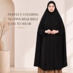 A woman wearing a jersey Hajj Umrah Scarf with Sleeves, providing full coverage for the head, neck, and shoulders without pins. By CLOTHIFYDOTPK